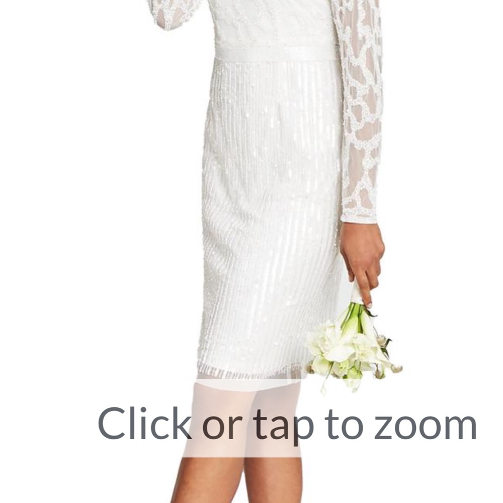 New wedding dress size 16-All beaded and sequined. Never worn. Tags still on